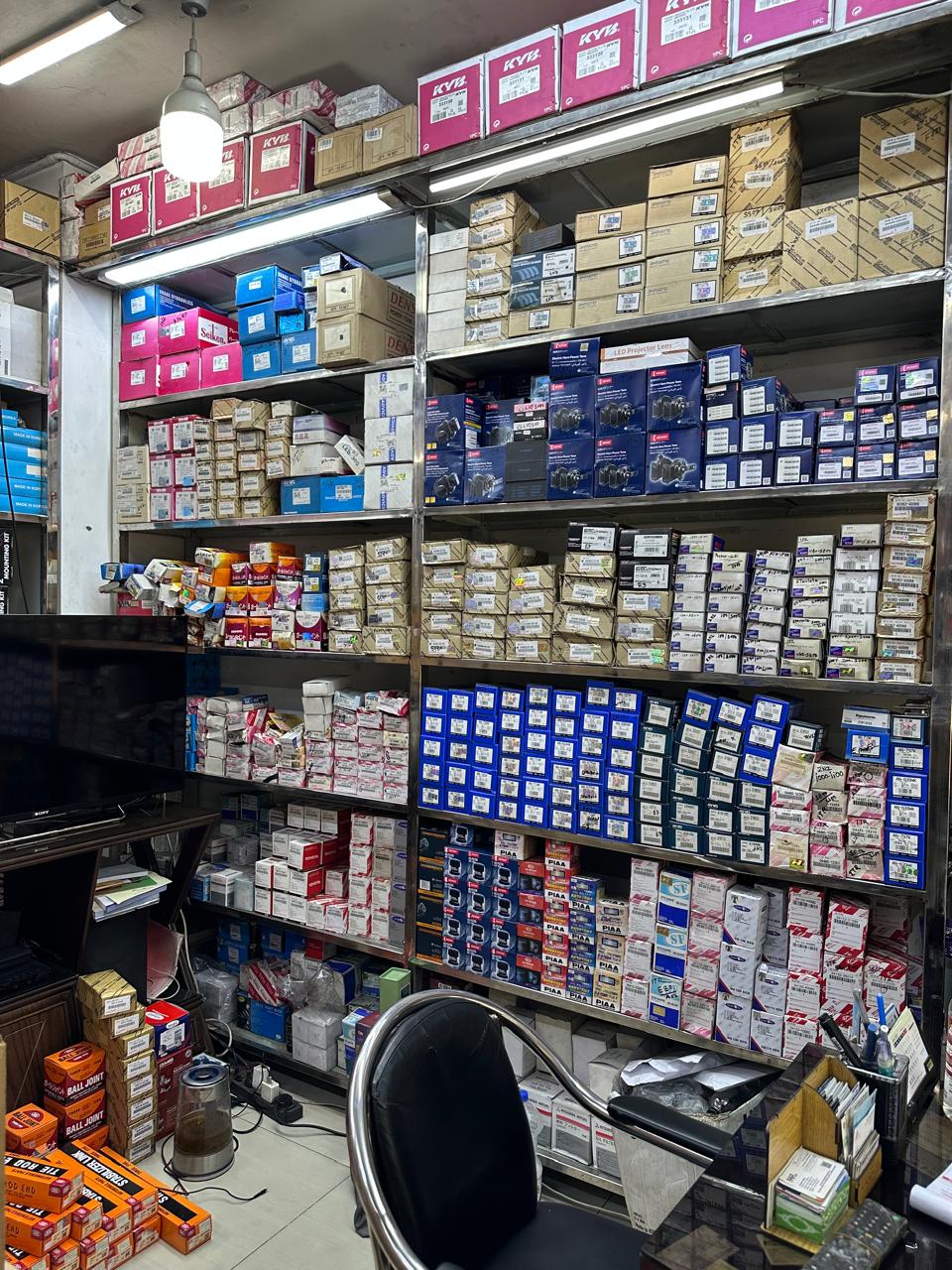 Shelves of genuine PIAA, Denso and OEM auto parts at Jaman Autos